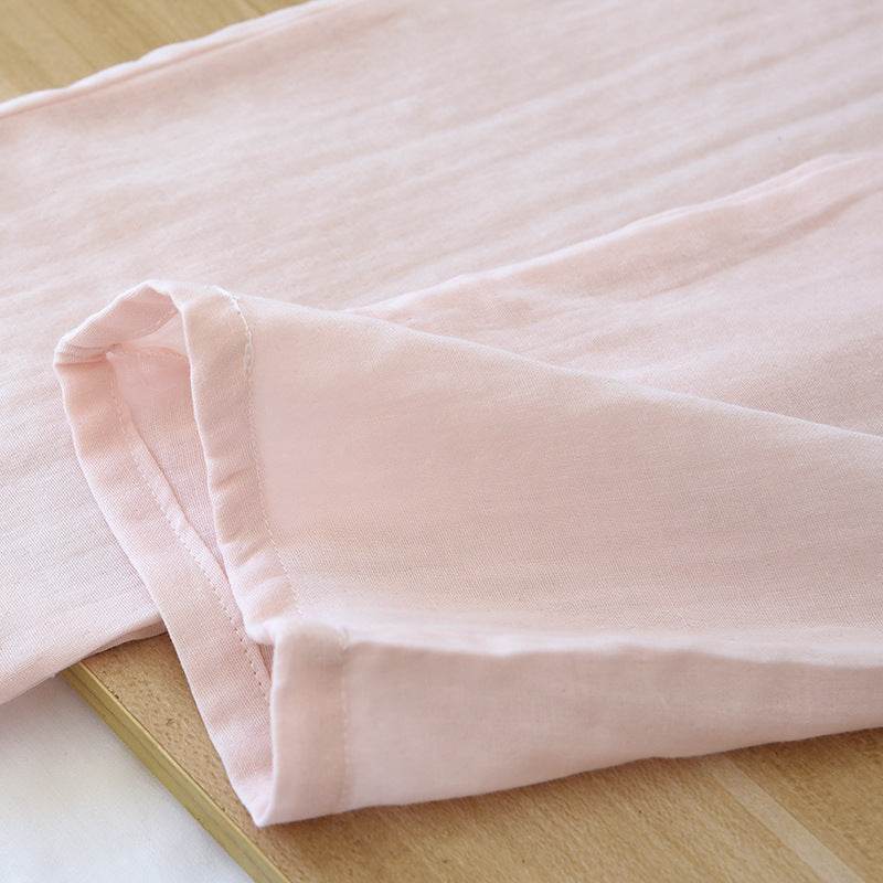 Soft light pink cotton gauze fabric detail of three-piece women's pajamas set