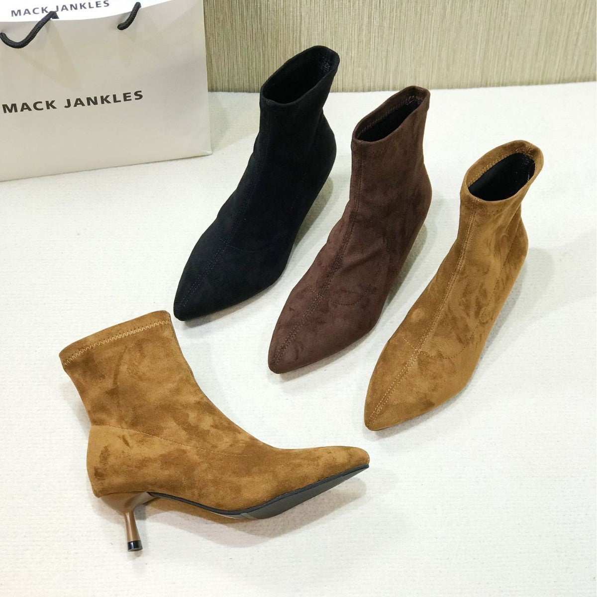 Small ankle boots with pointed toe and stiletto heels in black, brown, and camel microfiber material