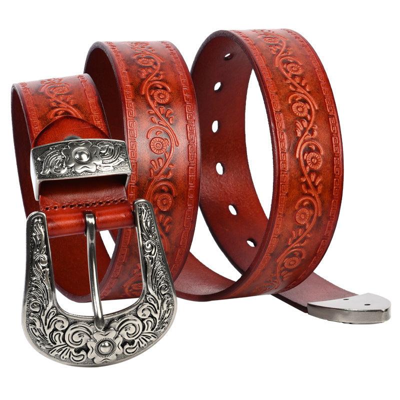 Embossed first layer cowhide men's leather belt with floral design and ornate metal buckle in reddish brown